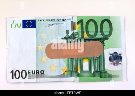 100 Euro bill with a band-aid Stock Photo