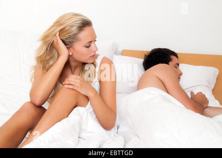 young couple in bed having crisis Stock Photo