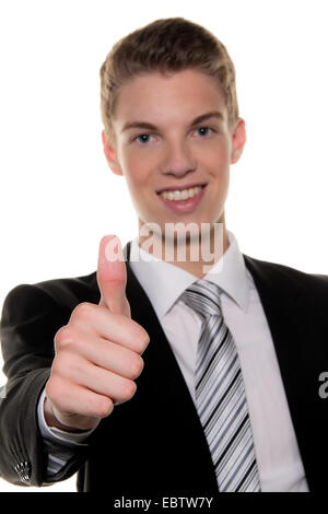 successful young man holds up thumb Stock Photo