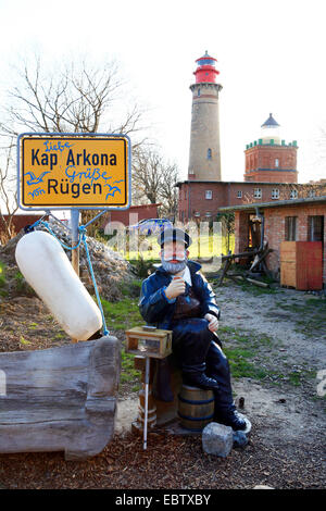 sculpture of an old sailor in a foregarden, lighthouse and Schinkelturm in the background, Germany, Mecklenburg-Western Pomerania, Ruegen, Kap Arkona Stock Photo