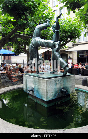 fountain Radschlaegerbrunnen at square Burgplatz in the old city of Dusseldorf, Germany, North Rhine-Westphalia, Duesseldorf Stock Photo