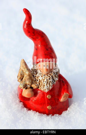Santa Claus figure in snow Stock Photo