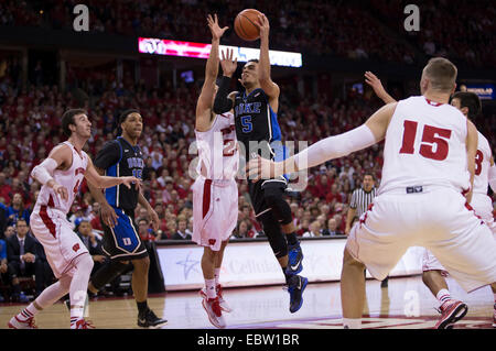 December 3, 2014: Duke Blue Devils guard Tyus Jones #5 goes in for a shot on Wisconsin Badgers guard Bronson Koenig #24 during the NCAA Basketball game between Duke Blue Devils and the Wisconsin Badgers at the Kohl Center in Madison, WI. Duke defeated Wisconsin 80-70. John Fisher/CSM. Stock Photo