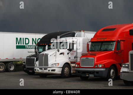 Semi trucks and dark storm clouds at Flying J Travel Plaza, Pasco, WA 99301, United States. truck stop. Stock Photo