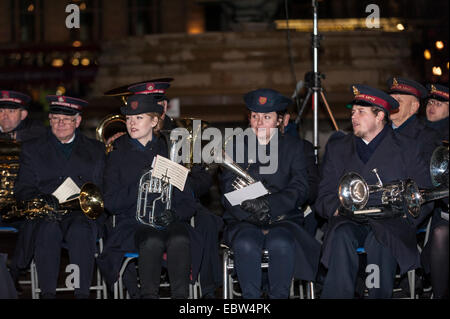 London, UK. 4th December, 2014. The annual Christmas tree lighting ceremony takes place in Trafalgar Square.  The tree is donated by the City of Oslo to the people of London each year as a token of gratitude for Britain’s support during the Second World War.  Pictured:  members of the Salvation Army Band. Credit:  Stephen Chung/Alamy Live News Stock Photo