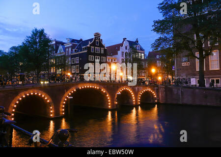 iIlluminated arch bridge, Netherlands, Amsterdam Stock Photo