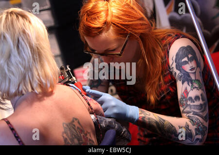 tattooer at work Stock Photo