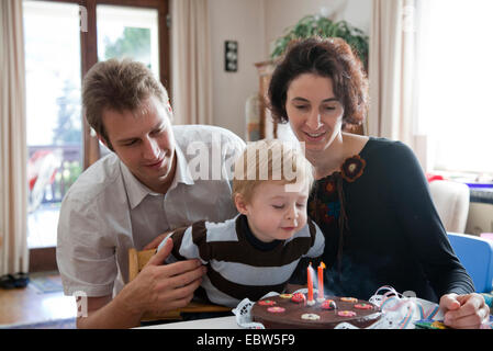 young family celebrating their sons second birthday Stock Photo