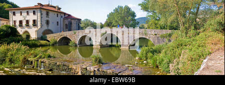 medieval bridge over Ri¡o Ulzama , Spain, Basque country, Navarra, Trinidad de Arre, bask. Villava Stock Photo