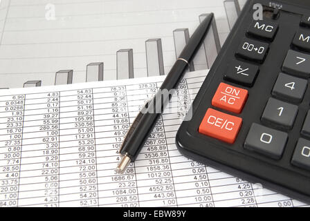 Pen and calculator on paper table with finance diagram Stock Photo