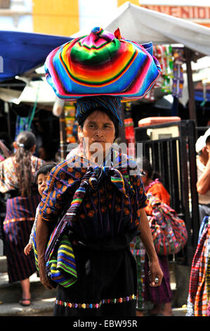 Maya woman with a bundle on the head on the market, Guatemala, Lake of Atitlan, Solola Stock Photo