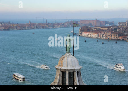 view on venice and bronze statue top of the dome of the San Giorgio Maggiore basilica in Venice Stock Photo