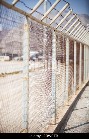 Fence with barbed wire Stock Photo