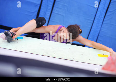 Female climber on artificial climbing wall, view from above Stock Photo