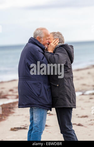 happy mature couple relaxing baltic sea dunes in autumn Stock Photo