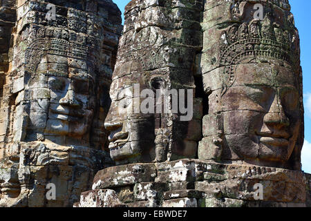 Giant face statue at Bayon, Khmer Temple in Angkor Thom, Siem Reap, Cambodia. Built in the late 12th / early 13th century as the Stock Photo