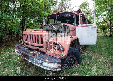 abandoned fire engine near former fish plant in Chernobyl Exclusion Zone, Ukraine Stock Photo