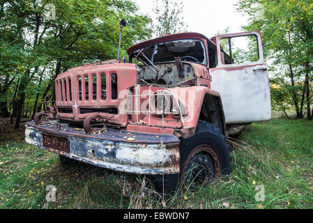 abandoned fire engine near former fish plant in Chernobyl Exclusion Zone, Ukraine Stock Photo