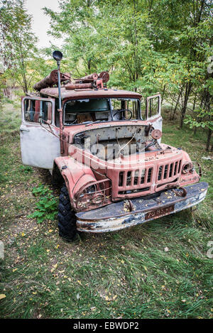 abandoned fire engine near former fish plant in Chernobyl Exclusion Zone, Ukraine Stock Photo