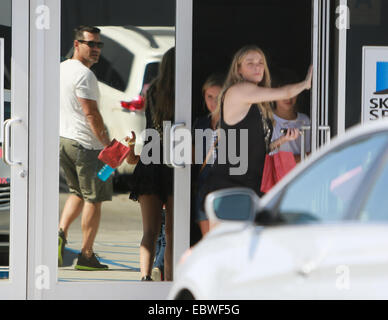 LeAnn Rimes exits by the backdoor while Brandi Glanville exits the side door of Sky High Sports center in Woodland hills after her son’s birthday party  Featuring: Eddie Cibrian,LeAnn Rimes Where: Los Angeles, California, United States When: 01 Jun 2014 Stock Photo