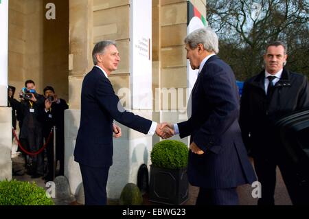 British Foreign Secretary Philip Hammond welcomes US Secretary of State John Kerry for the London Conference on Afghanistan at Lancaster House December 4, 2014 in London. Stock Photo