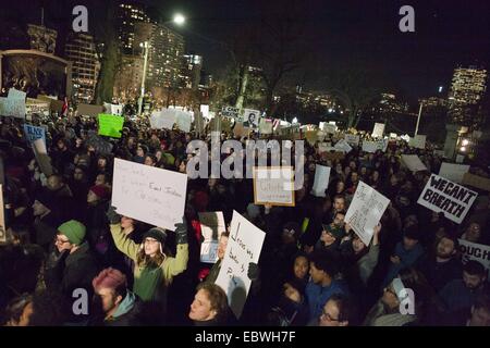 Boston, Massachusetts, USA. 4th Dec, 2014. Protesters gather in front of the State House, hold signs and chant while protesting the verdict of the NY chokehold case during the Christmas tree lighting ceremony on Thursday, December 4, 2014. Credit:  Alena Kuzub/ZUMA Wire/ZUMAPRESS.com/Alamy Live News