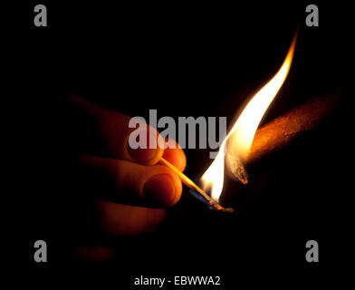 lighting a cigar Stock Photo