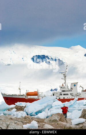 vessel Antarctic Dream in drift ice, Antarctica, Neko Cove Harbor Stock Photo