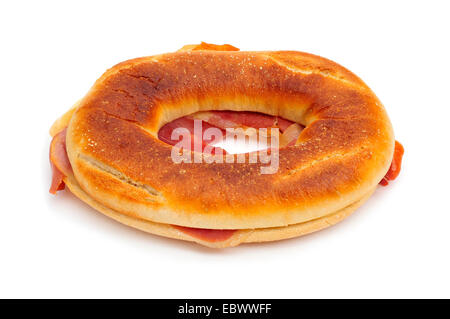 a spanish rosca de jamon serrano, a donut-shaped serrano ham sandwich, on a white background Stock Photo