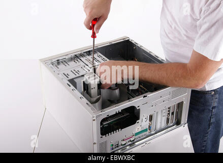 man reparing a PC Stock Photo