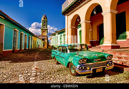 Old worn 1958 Classic Chevy on cobblestone street in center square of Trinidad, Cuba, Trinidad Stock Photo