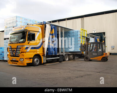 trucks are loaded with goods at the depot in a shipping company Stock ...