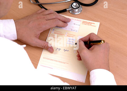 doctor filling an certificate of incapacity for work Stock Photo