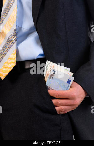corruption, man pulling money from the jacket pocket, Germany Stock Photo
