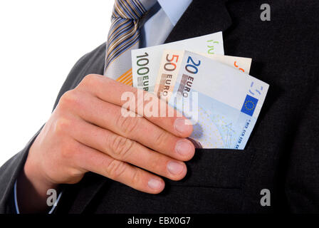 corruption, man pulling money from the jacket pocket, Germany Stock Photo