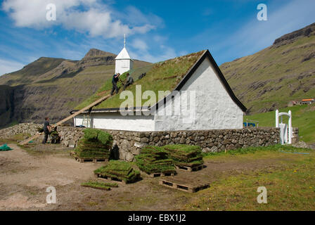 roof works with sods at the church of Saksun, Denmark, Faroe Islands, Streymoy Stock Photo