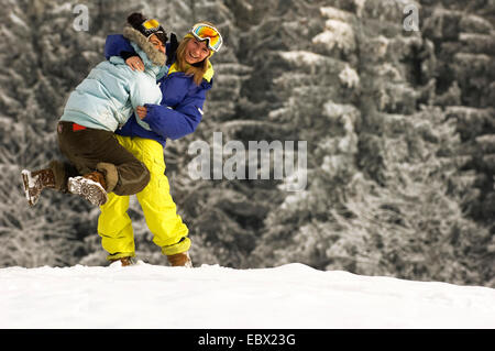 young woman fooling around in winter holydays, France Stock Photo