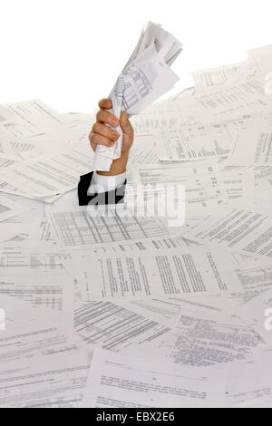 business man bogging in a heap of text documents with only one arm looking out Stock Photo
