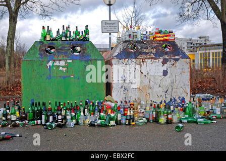 empty bottles around a abuzzed bottle bank, Germany Stock Photo