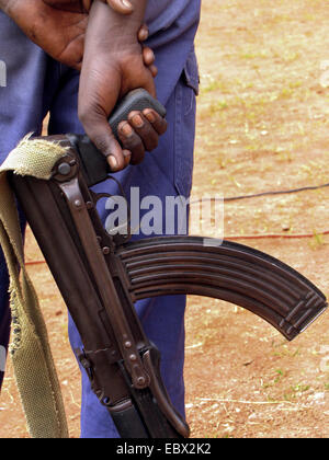 police officer with Kalashnikow at the festivities for the International Day of Human Rights (10 December 2009) celebrated jointly by the Burundian government and the UN Integrated Office in Burundi, Burundi, Bujumbura rural, Kabezi Stock Photo
