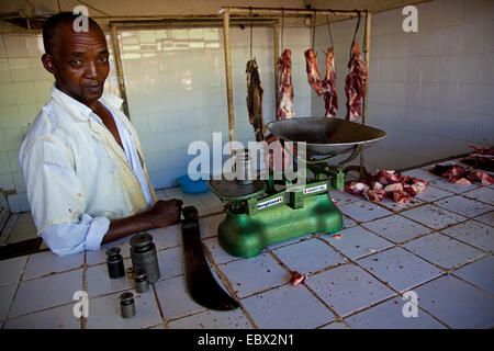 butcher standing next scale, Rwanda, Nyamirambo, Kigali Stock Photo