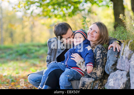 Young family enjoying beautiful autumn day