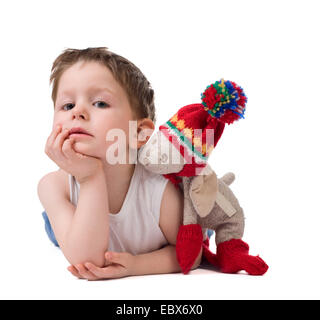 Cute 3-4 years old boy with his best toy friend Stock Photo