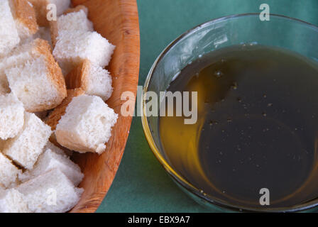 grape seed oil in a bowl and pieces of bread, Germany, Rhineland-Palatinate, Palatinate Stock Photo