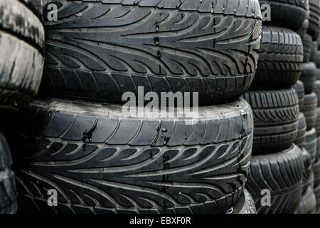Used tires lying on a pile Stock Photo