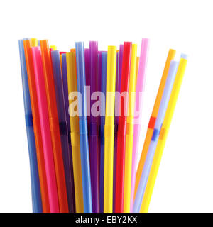 Multicolored plastic straws for drinking on a white background. Shallow depth of field. Stock Photo