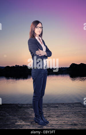 portrait of a business woman on the river jetty Stock Photo