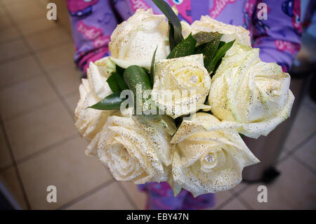 Bridesmaid holding a white bridal wedding bouquet Stock Photo