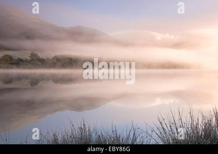 Misty morning over Loweswater in the Lake District, Cumbria, England. Autumn (November) 2013. Stock Photo