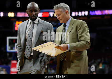 November 24, 2014: Philadelphia 76ers head coach Brett Brown looks on with assistant coach Lloyd Pierce during the NBA game between the Portland Trail Blazers and the Philadelphia 76ers at the Wells Fargo Center in Philadelphia, Pennsylvania. The Portland Trail Blazers won 114-104. Stock Photo